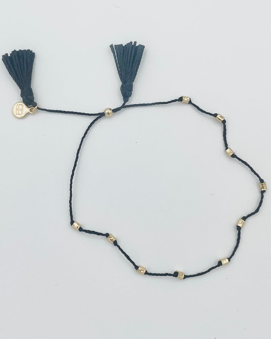 Black String and Gold Bead Bracelet