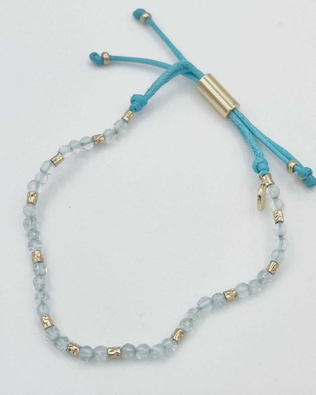 Blue String and Gold Bracelet