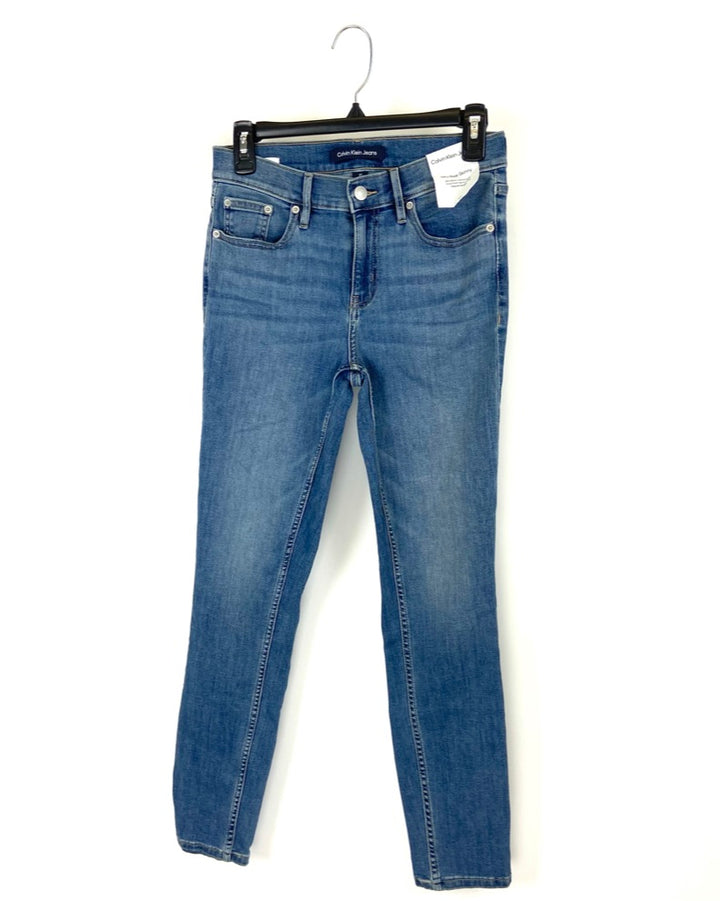 Medium Wash Mid Rise Skinny Jean - Size 25, 26, 27, 29